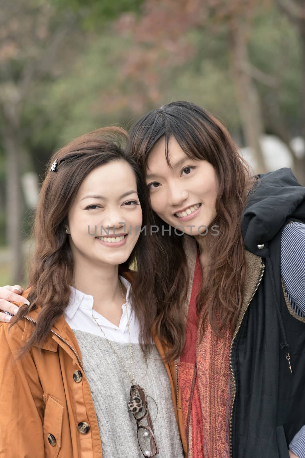 Happy smiling Asian women in the park, taipei, Taiwan.