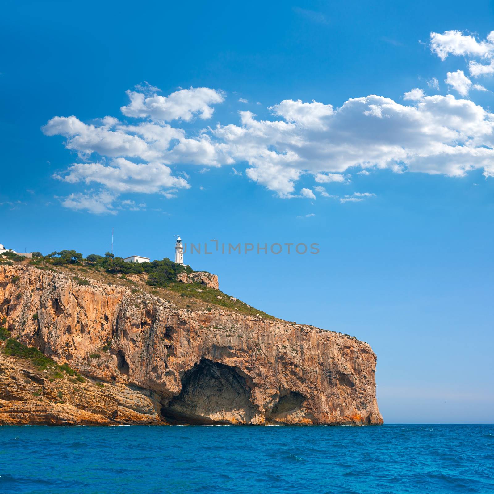 Cabo de la Nao Cape lighthouse in mediterranean sea Alicante by lunamarina