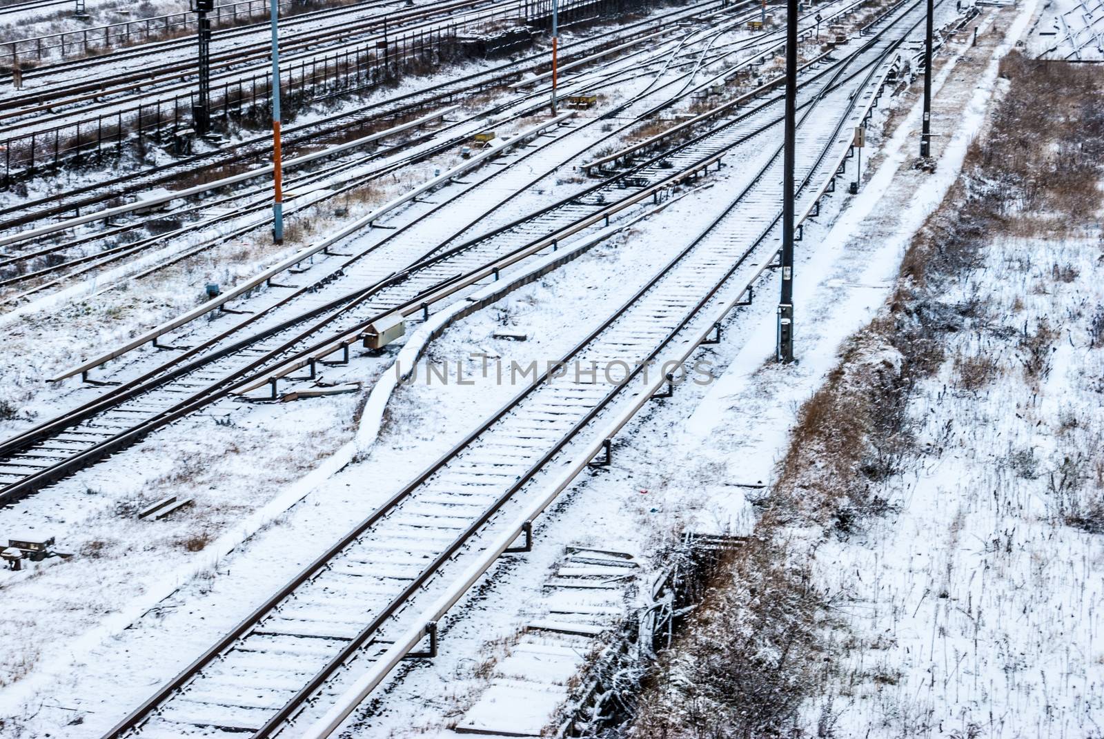 railroad tracks covered with snow in the winter