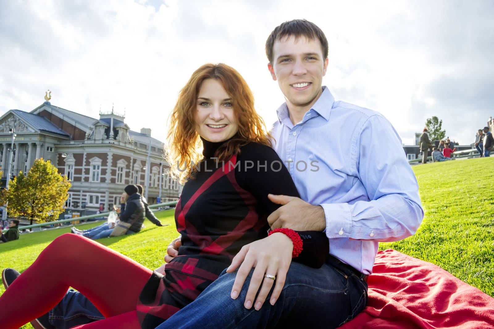 Outdoor happy couple in love, Museum Plein, autumn Amsterdam background