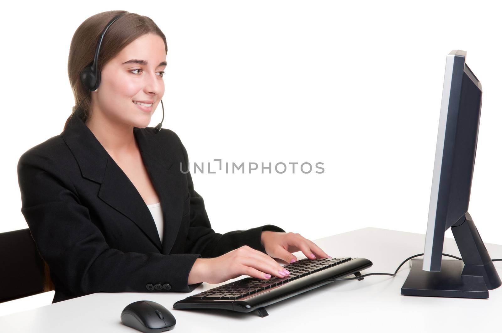 Corporate woman talking over her headset, isolated in a white background