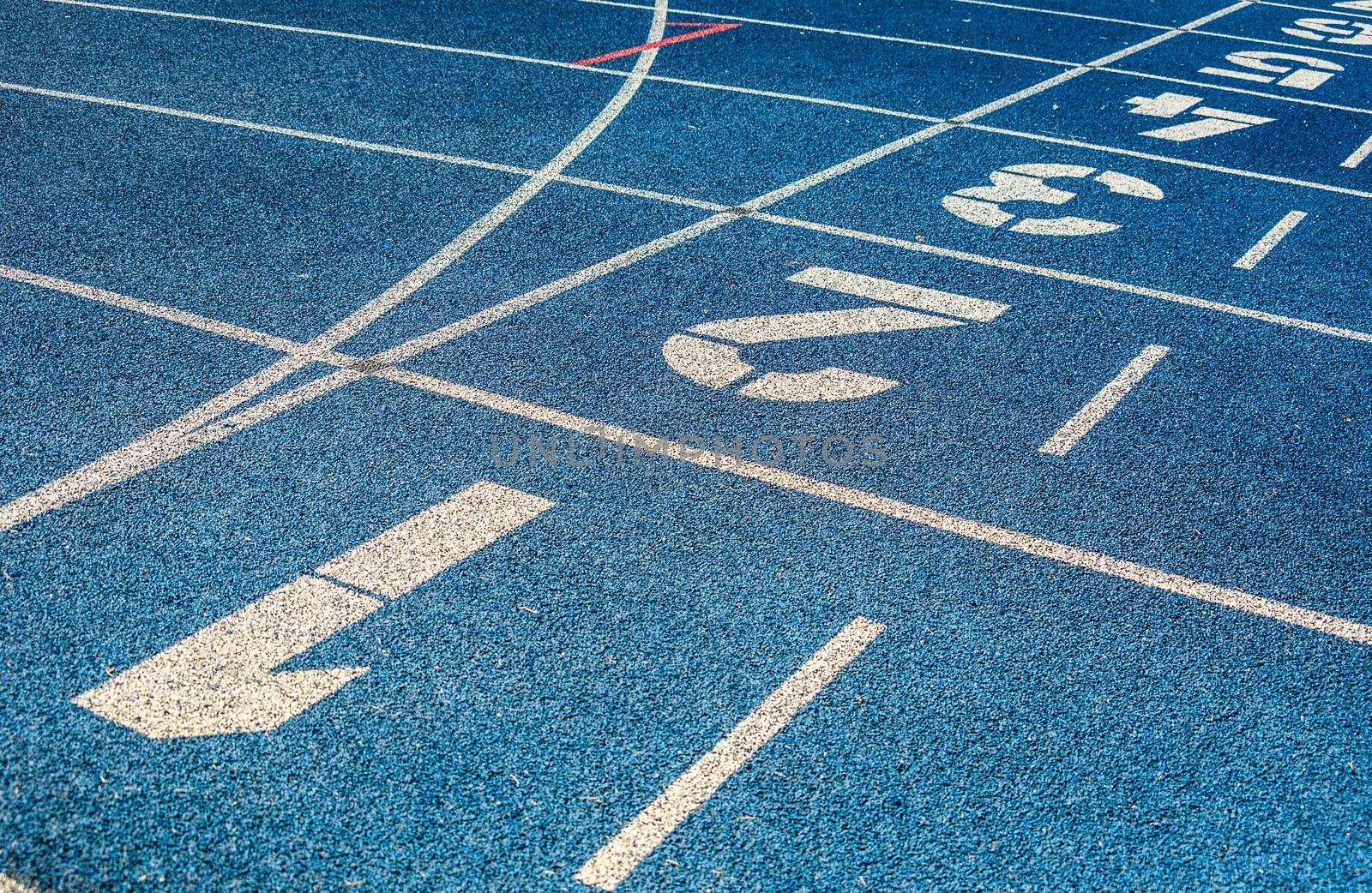 background of the start line of blue running tracks