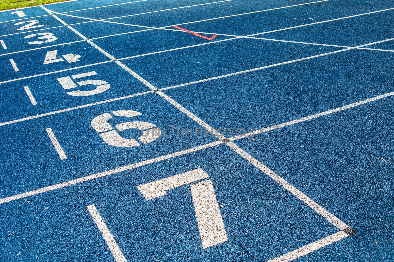 background of the start line of blue running tracks