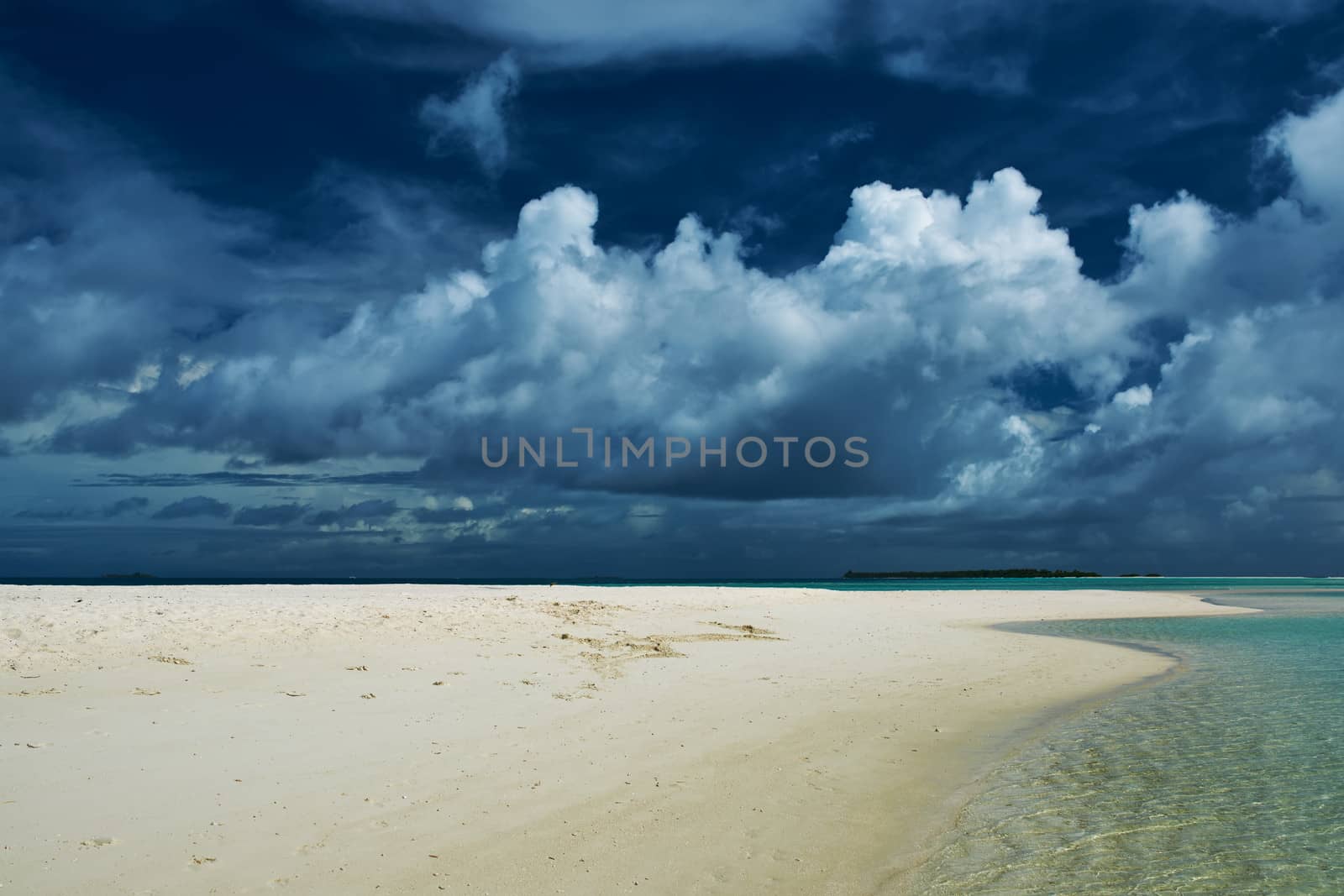 Beautiful island beach with sandspit at Maldives