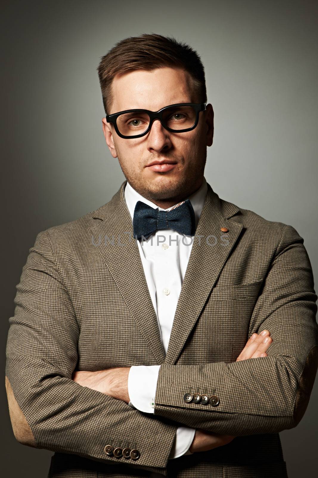 Confident nerd in eyeglasses and bow tie  by haveseen