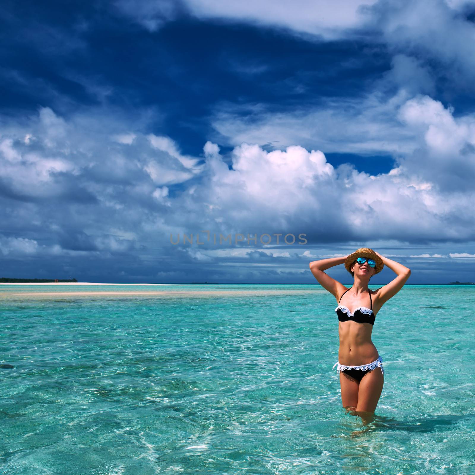 Woman in bikini at tropical beach