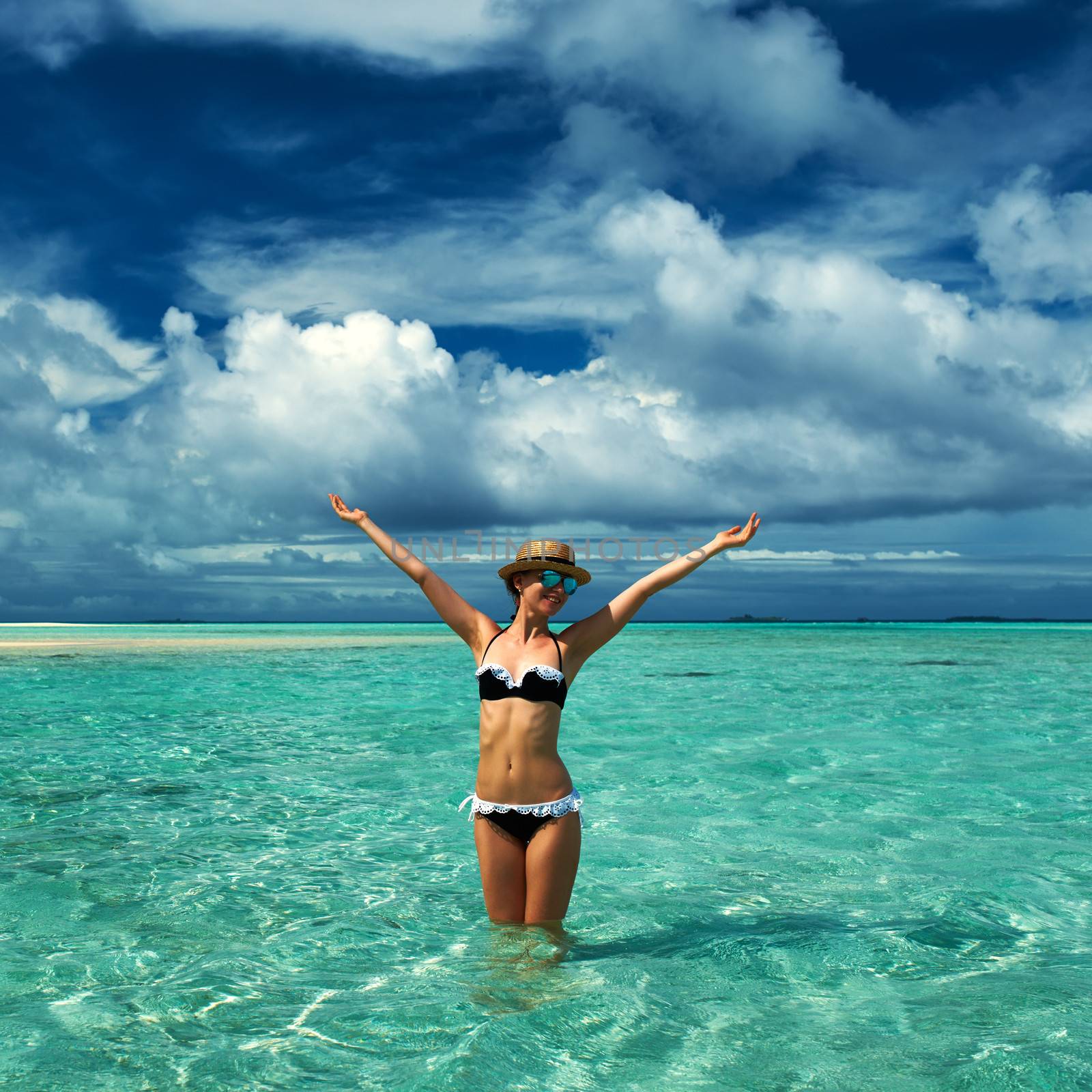 Woman in bikini at tropical beach