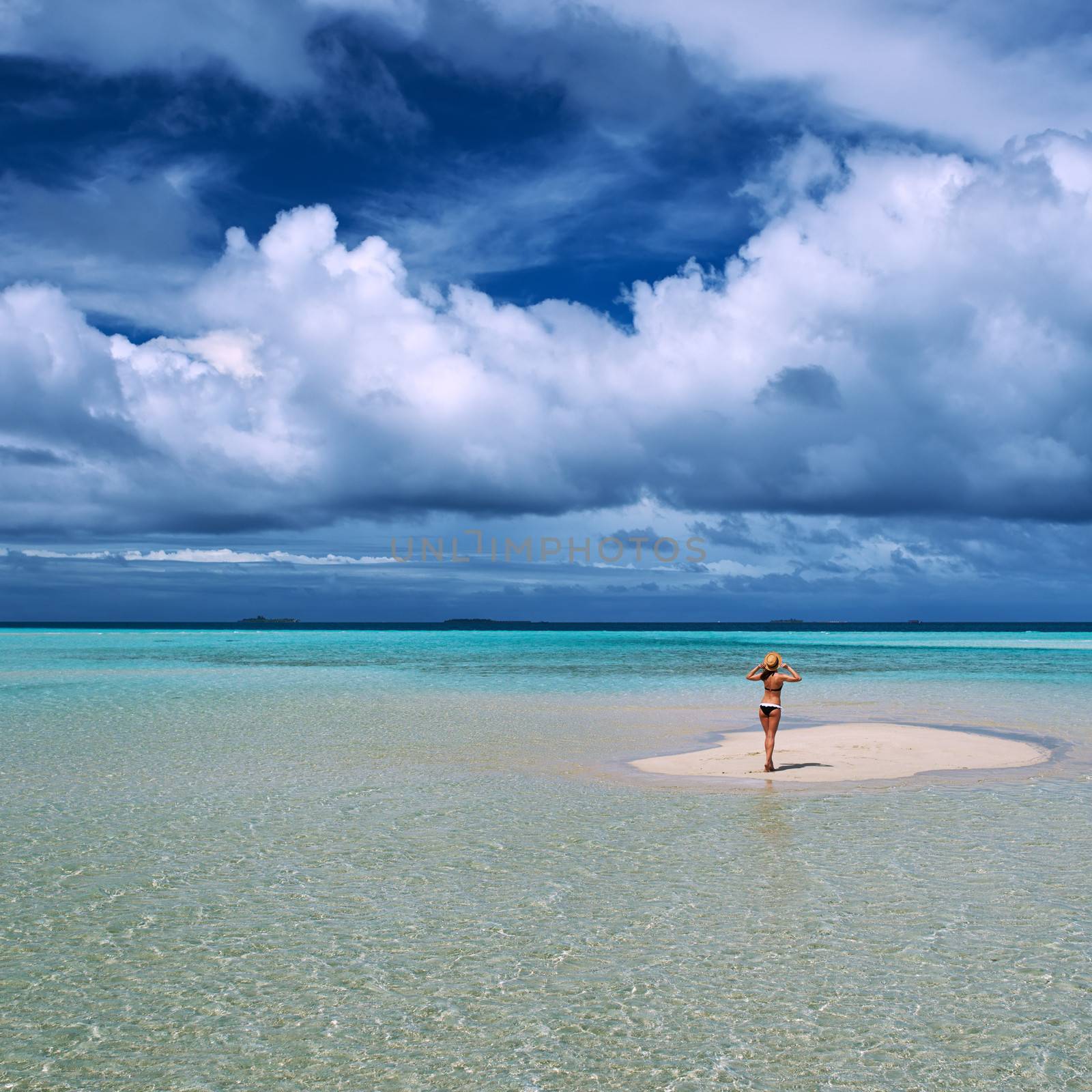 Woman in bikini at tropical beach