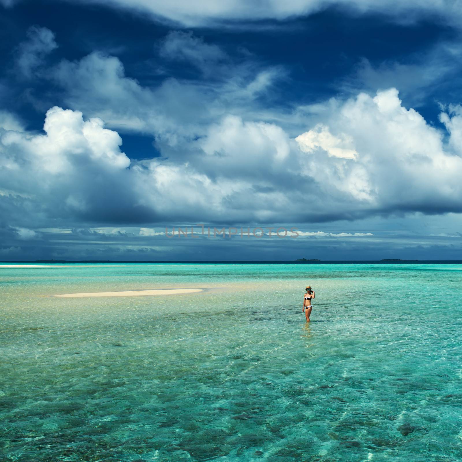 Woman in bikini at tropical beach