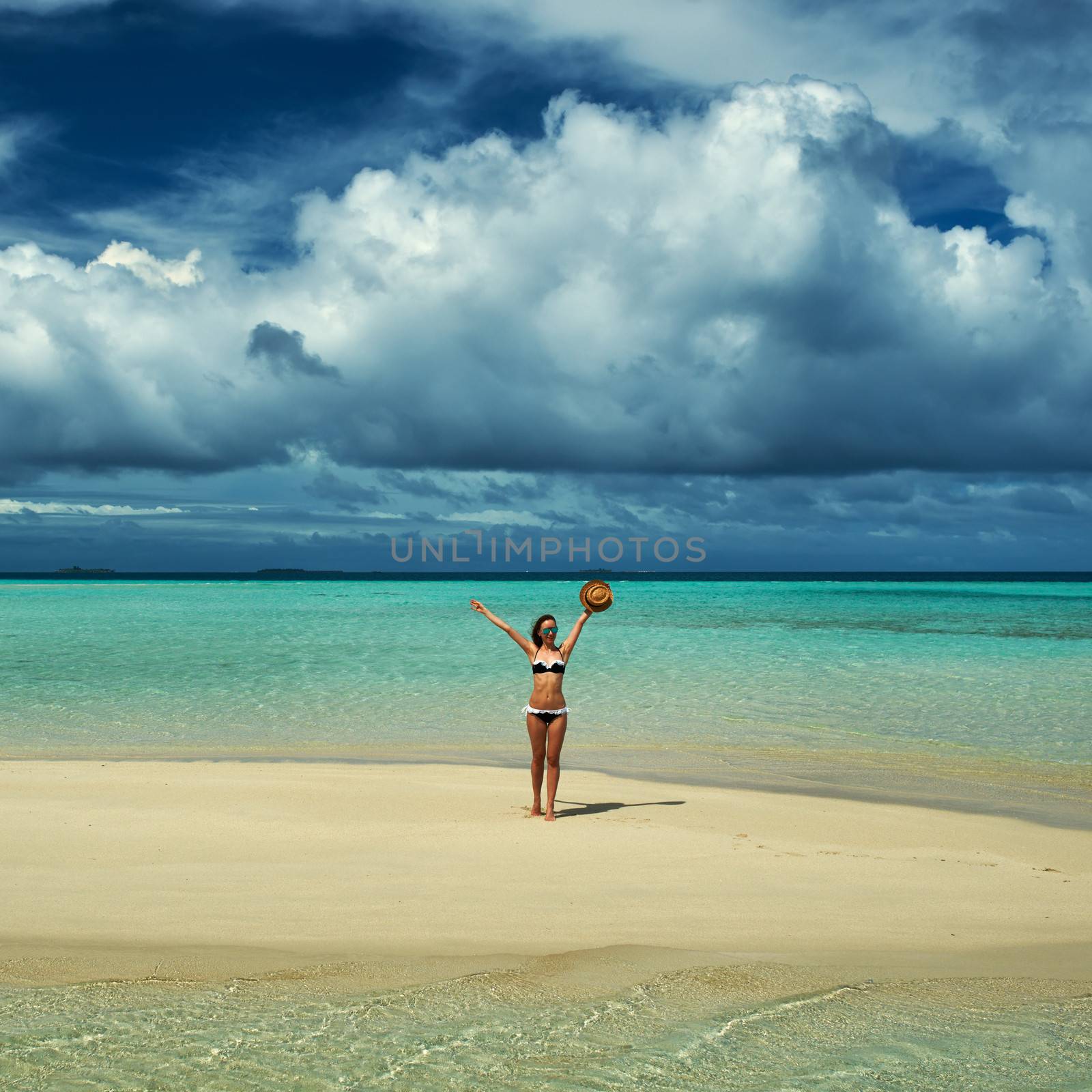 Woman in bikini at tropical beach