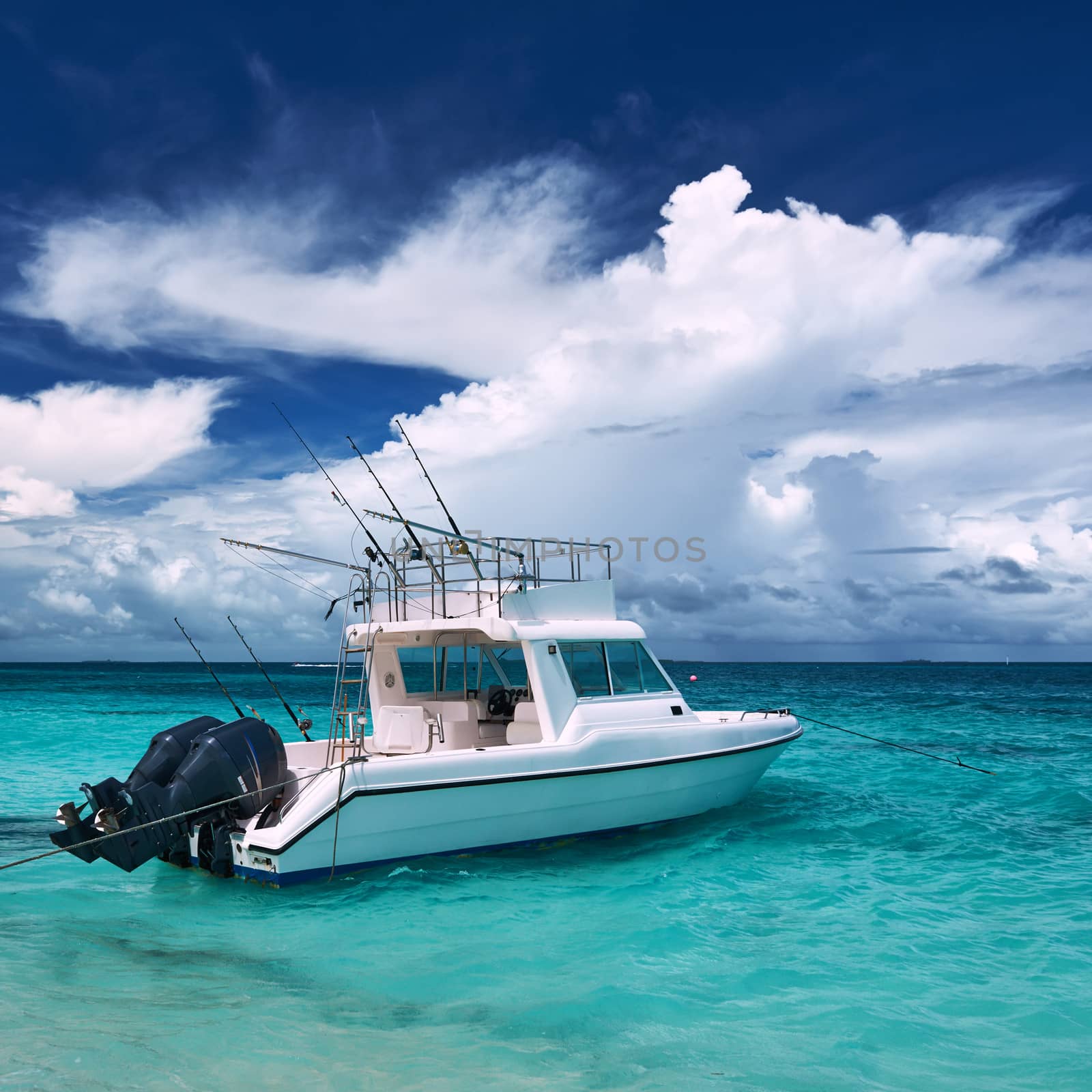 Beautiful island beach with motor boat  by haveseen