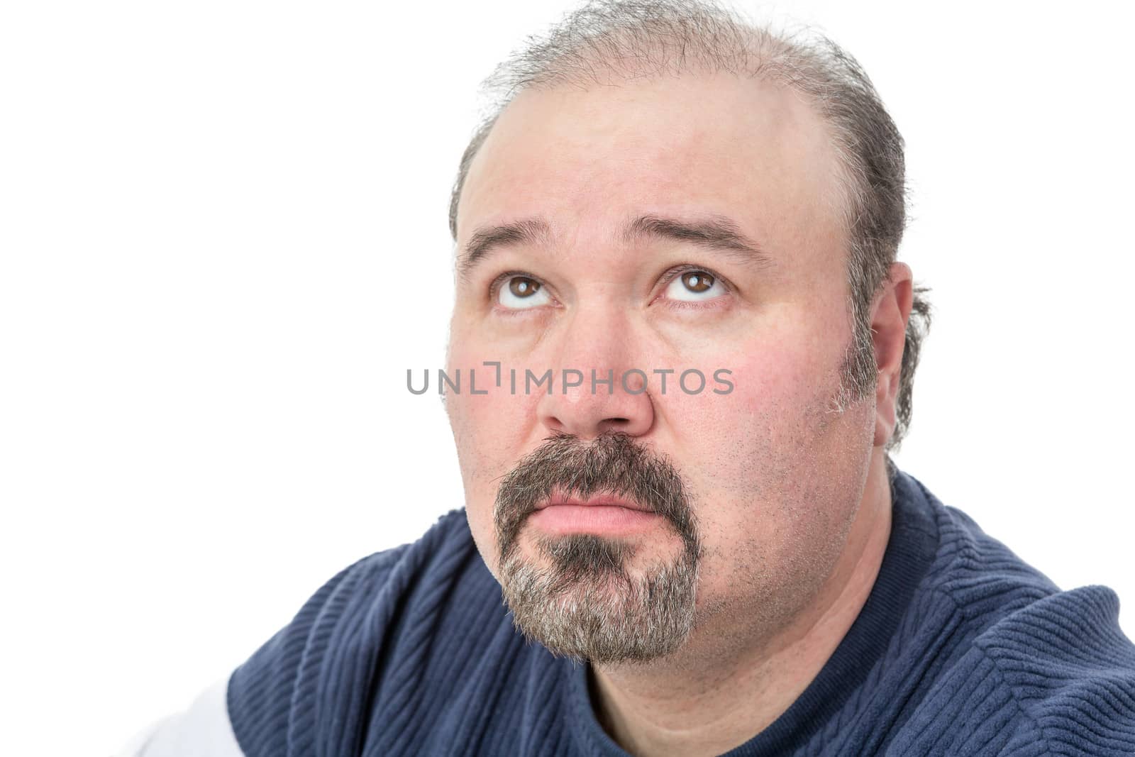 Close-up portrait of a mature man thinking by coskun