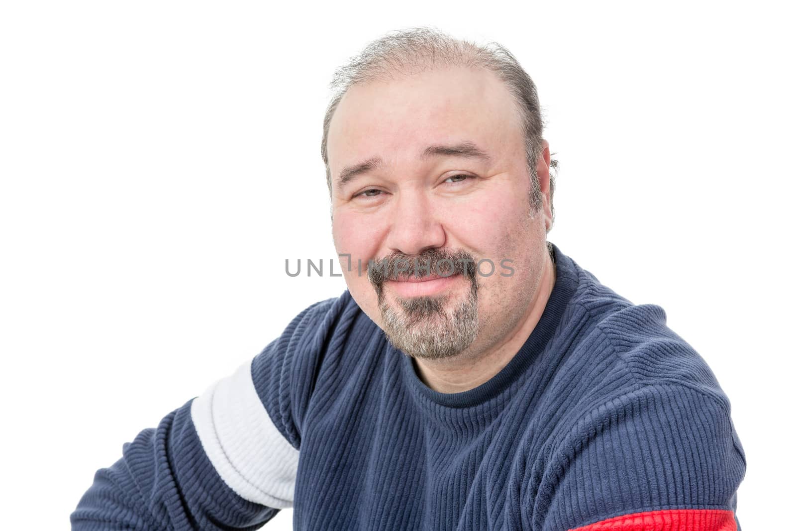 Close-up portrait of a friendly balding mature man wearing a goatee