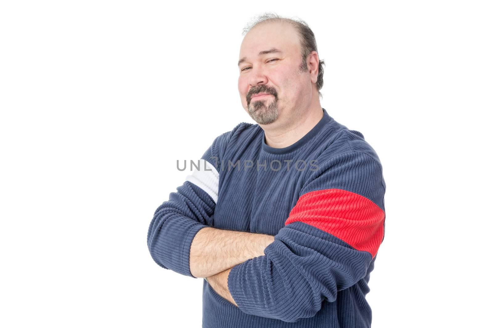 Portrait of a mature man in casual clothing with arms folded on a white background