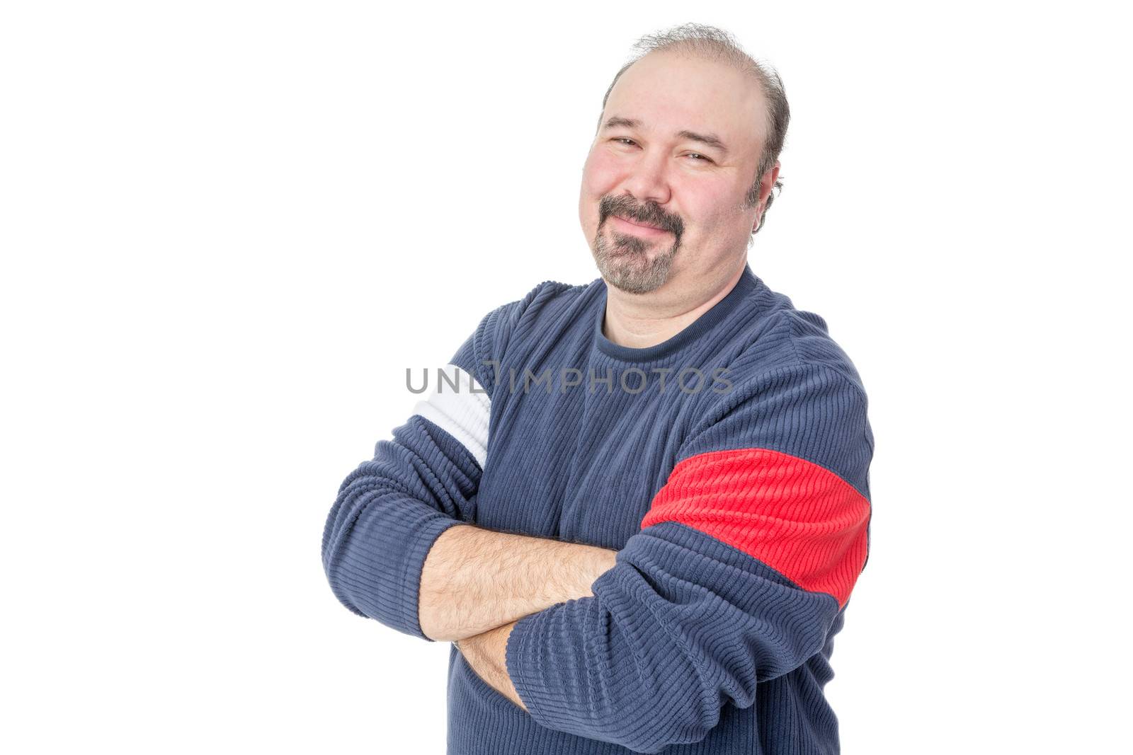 Portrait of a friendly balding mature man with arms crossed on a white background