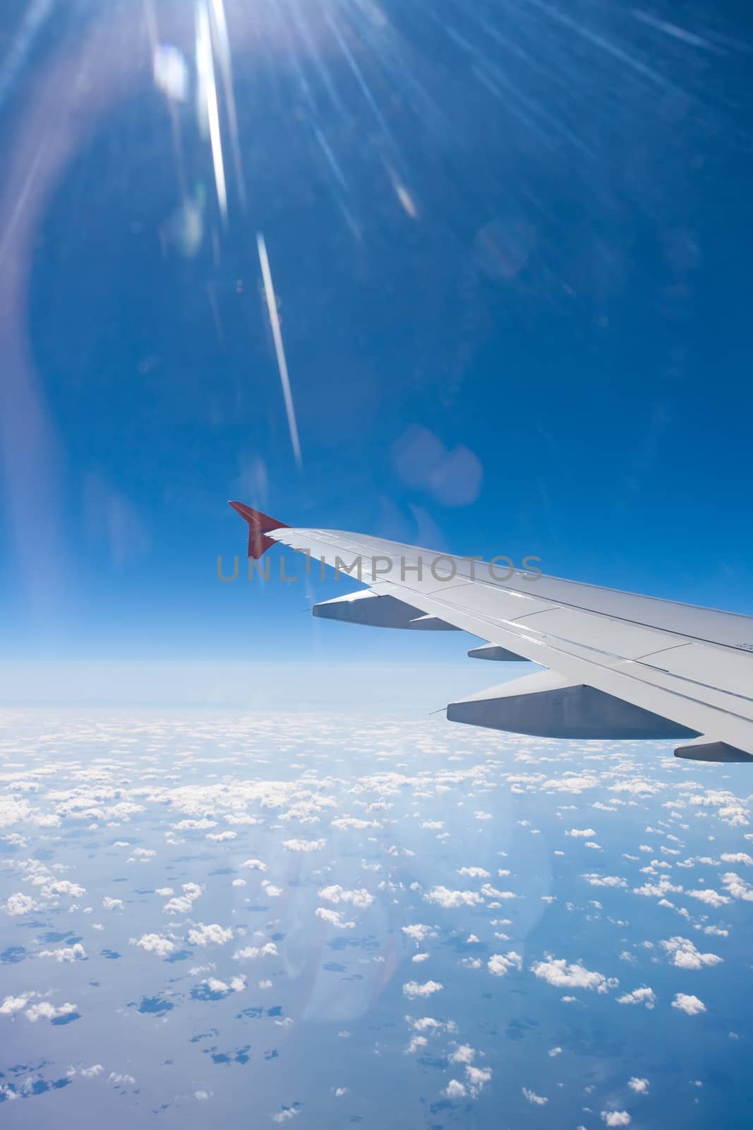 Beautiful view of  airplane wing on blue sky background