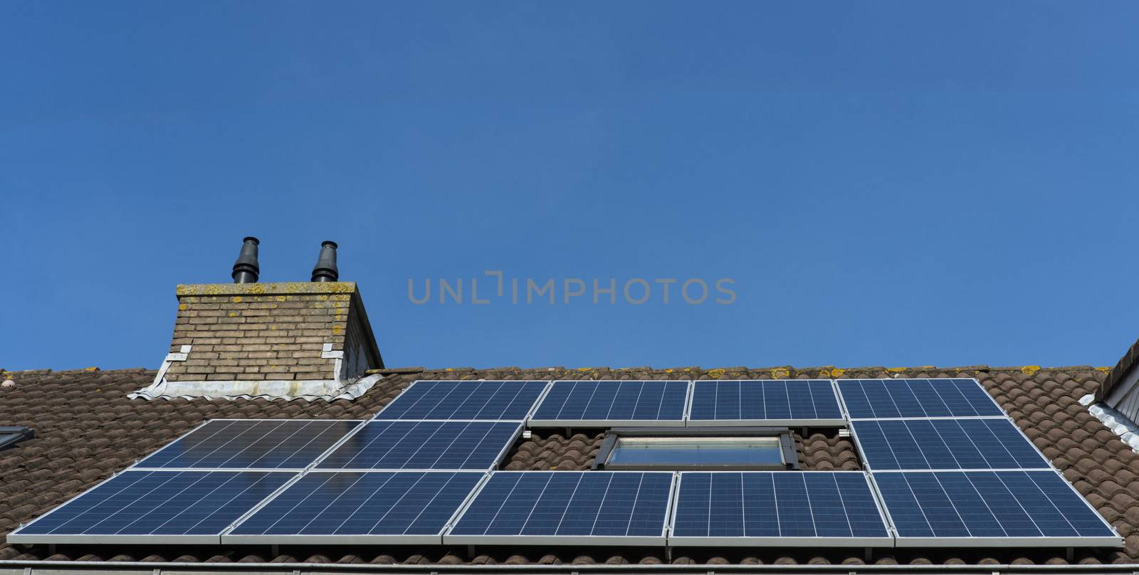 roof with solar panels by compuinfoto