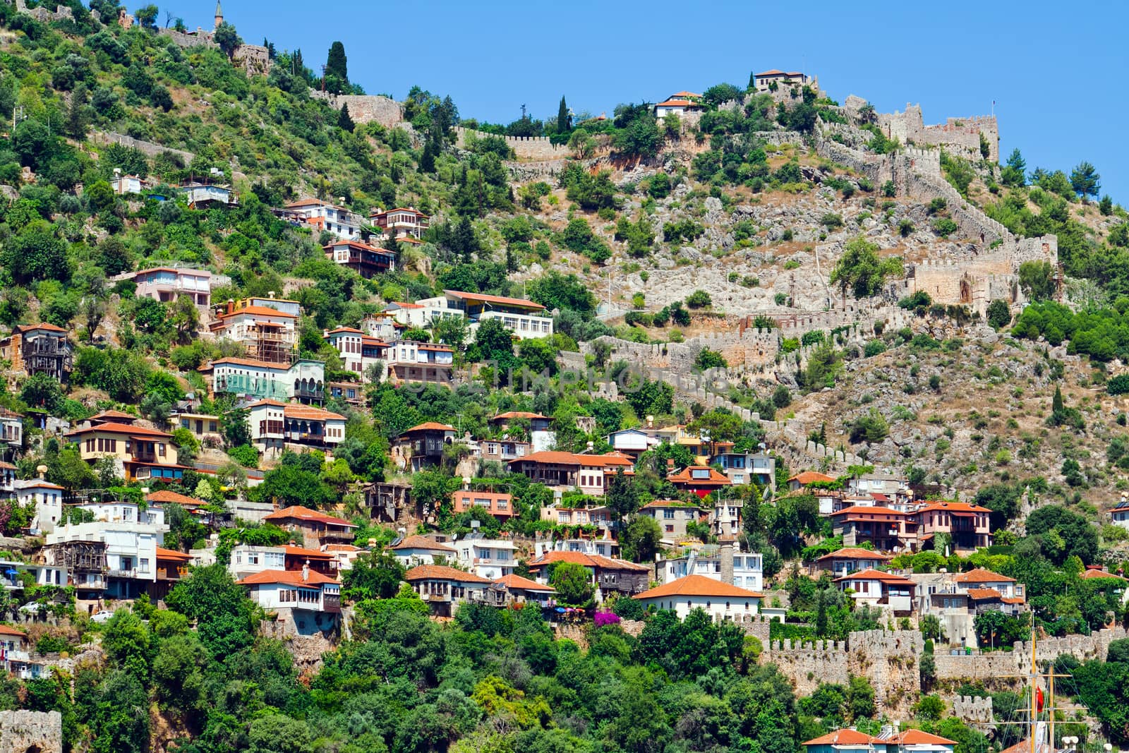 Turkish houses of Mediterranean style on the mountain slope in Alanya