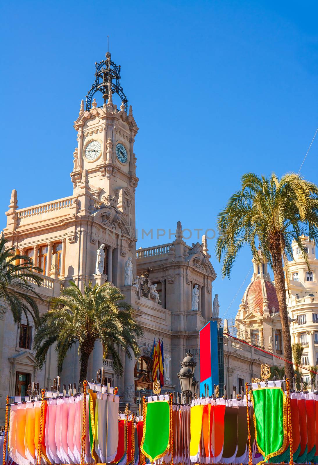 Valencia Ayuntamiento city town hall with fallas colorful flags in spain