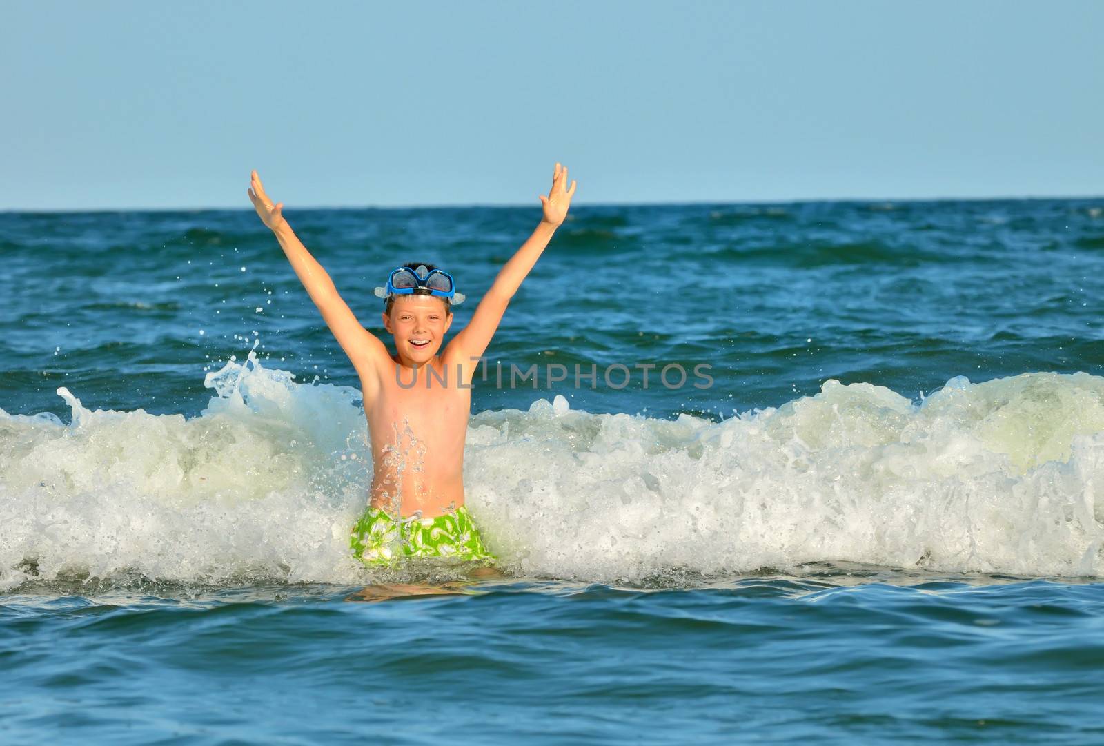 Young boy enjoying the sea by mady70