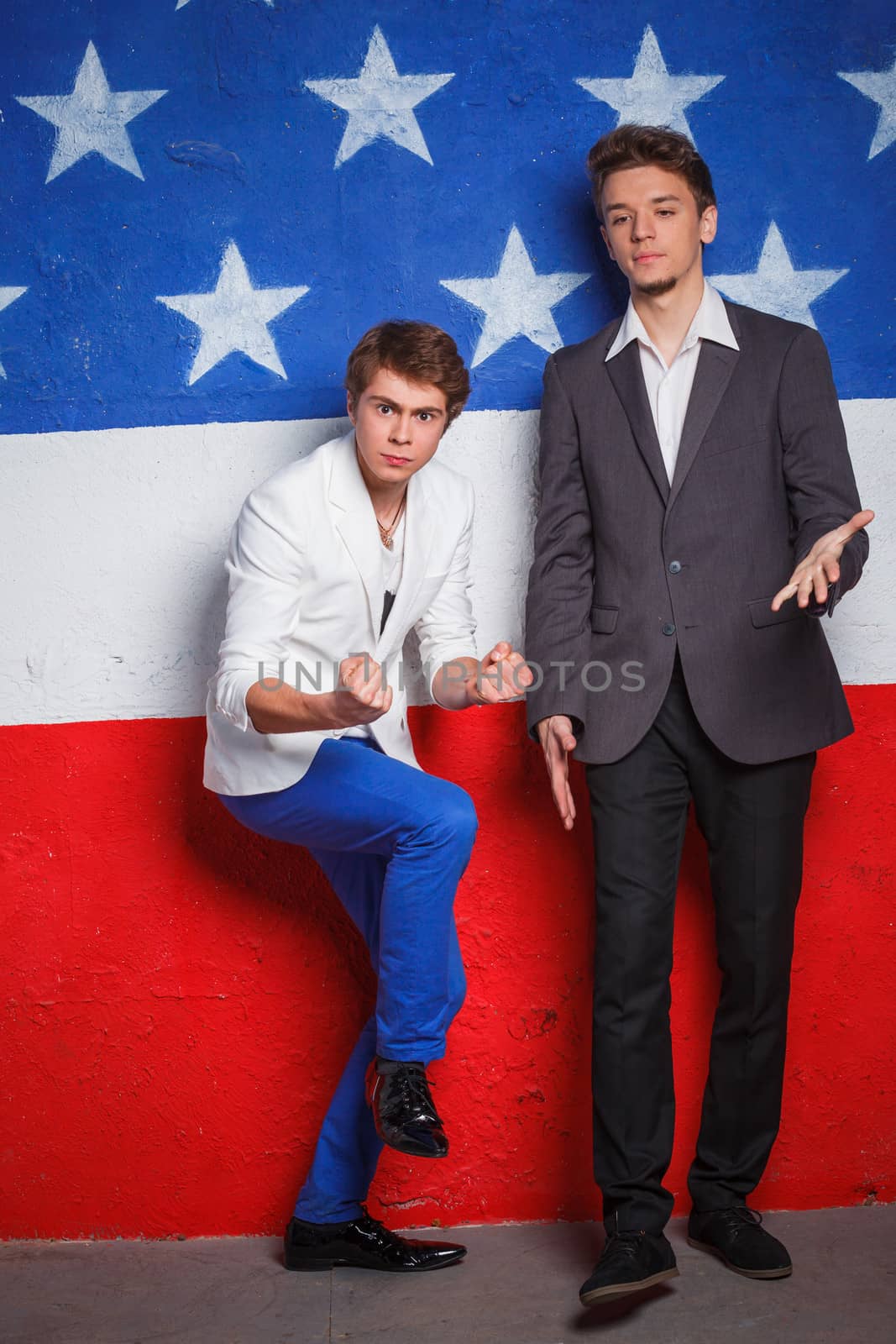 Young cool teenagers boy on American flag background.