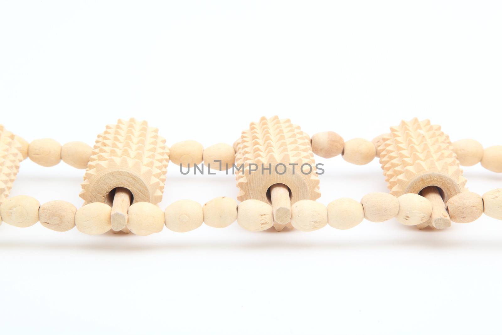 wooden massager on a white background