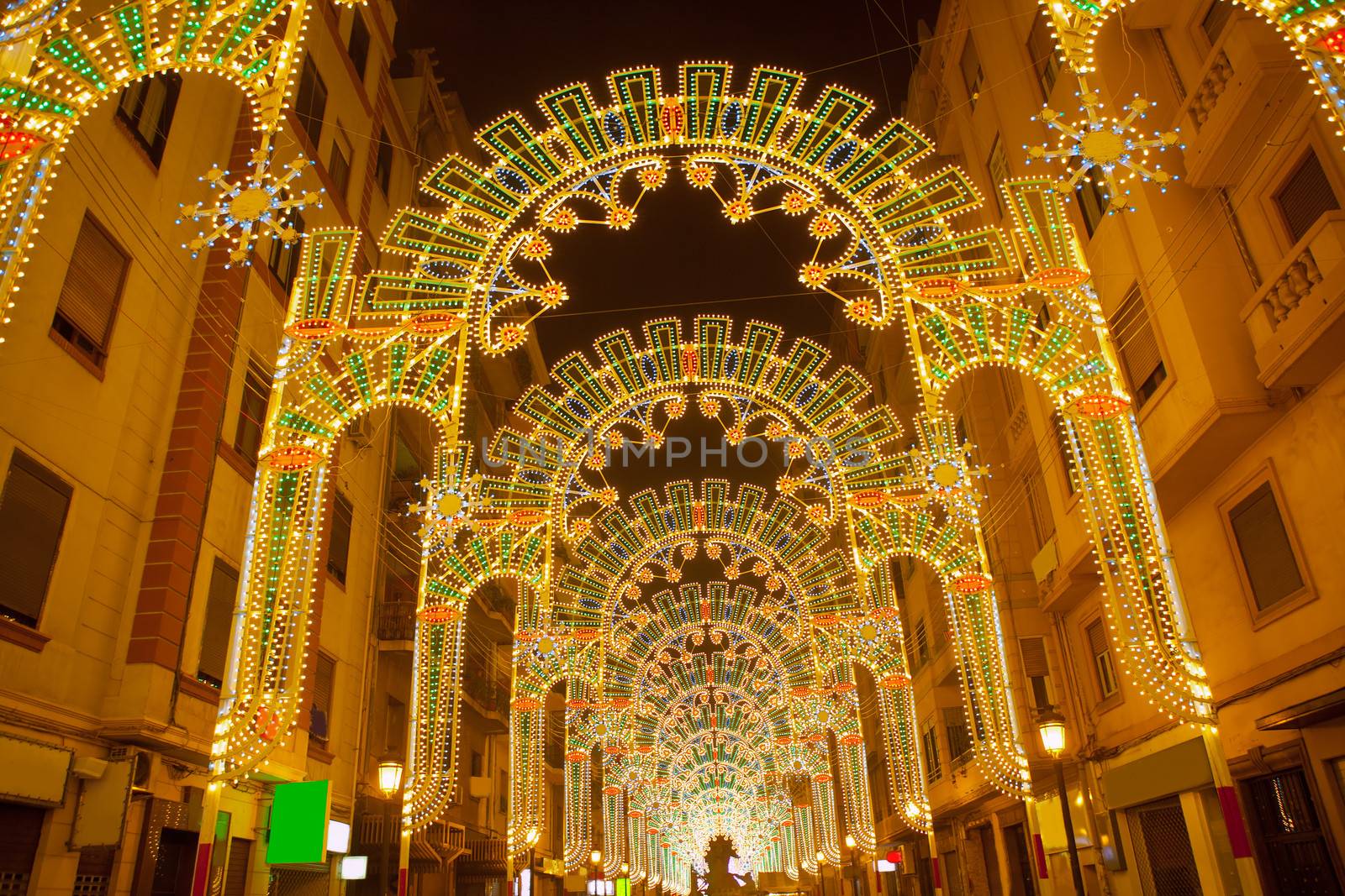 Beautiful night lights in Fallas fest of Valencia in calle Sueca by lunamarina