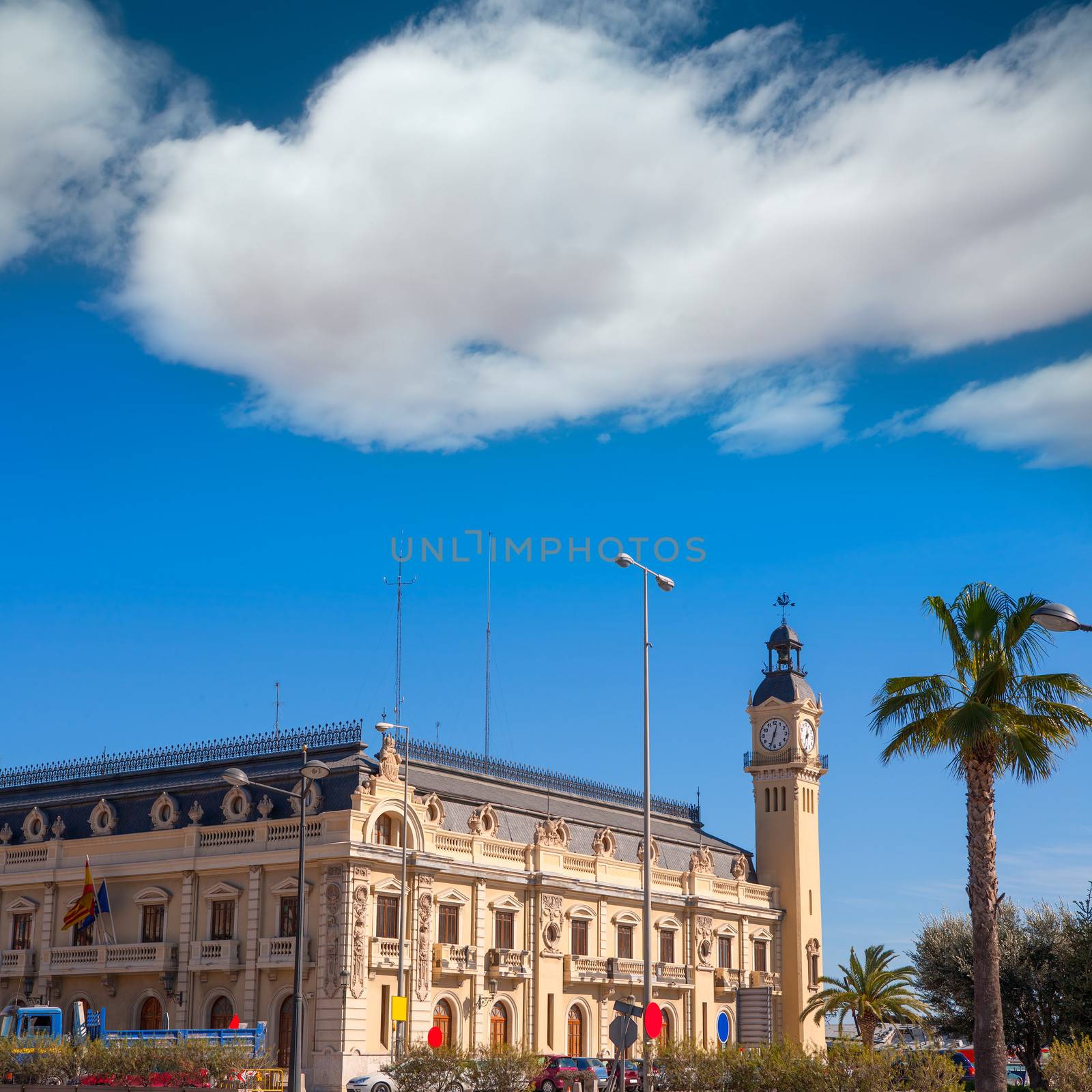 Valencia Port building with tower and palm tree by lunamarina