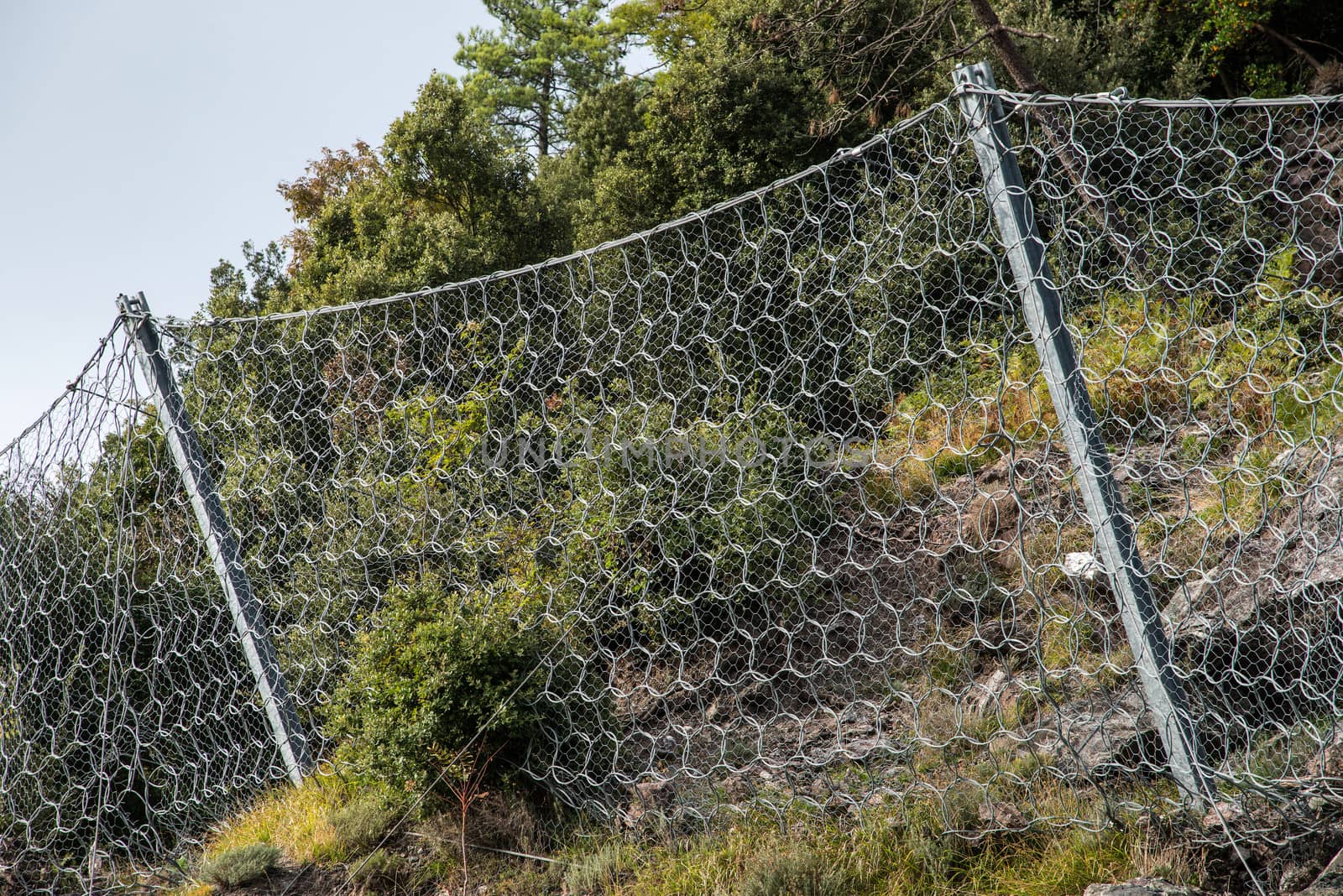 wire containment mesh repair constructed for the passage of vehicles by landslides
