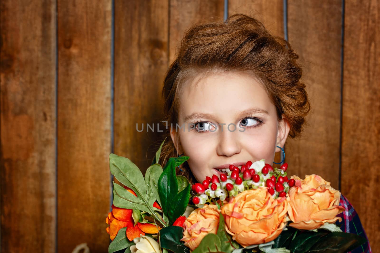 Cute teen girl with a bouquet of beautiful flowers