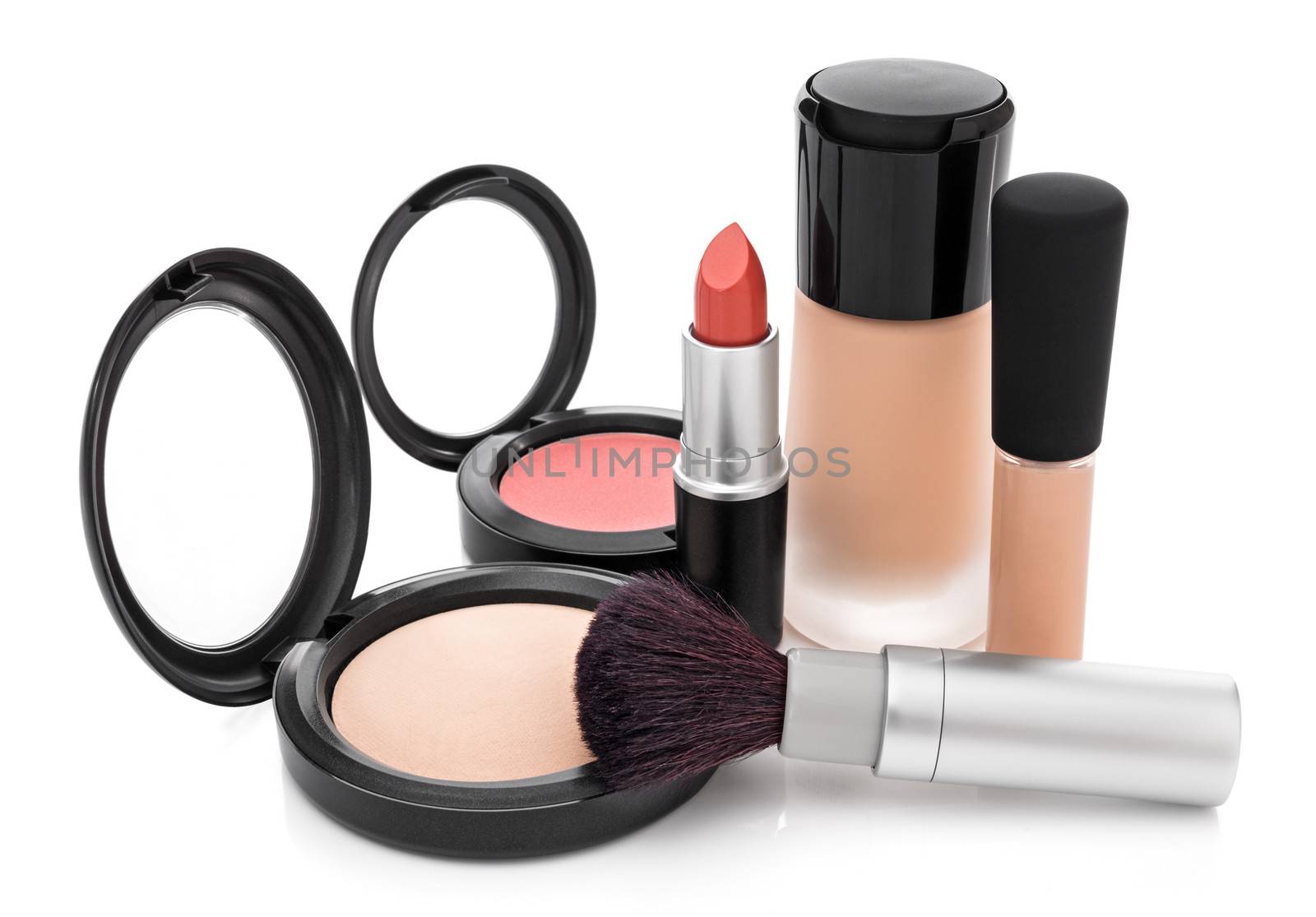 Makeup for natural look. Foundation, concealer, face powder, blush, lipstick, brush.