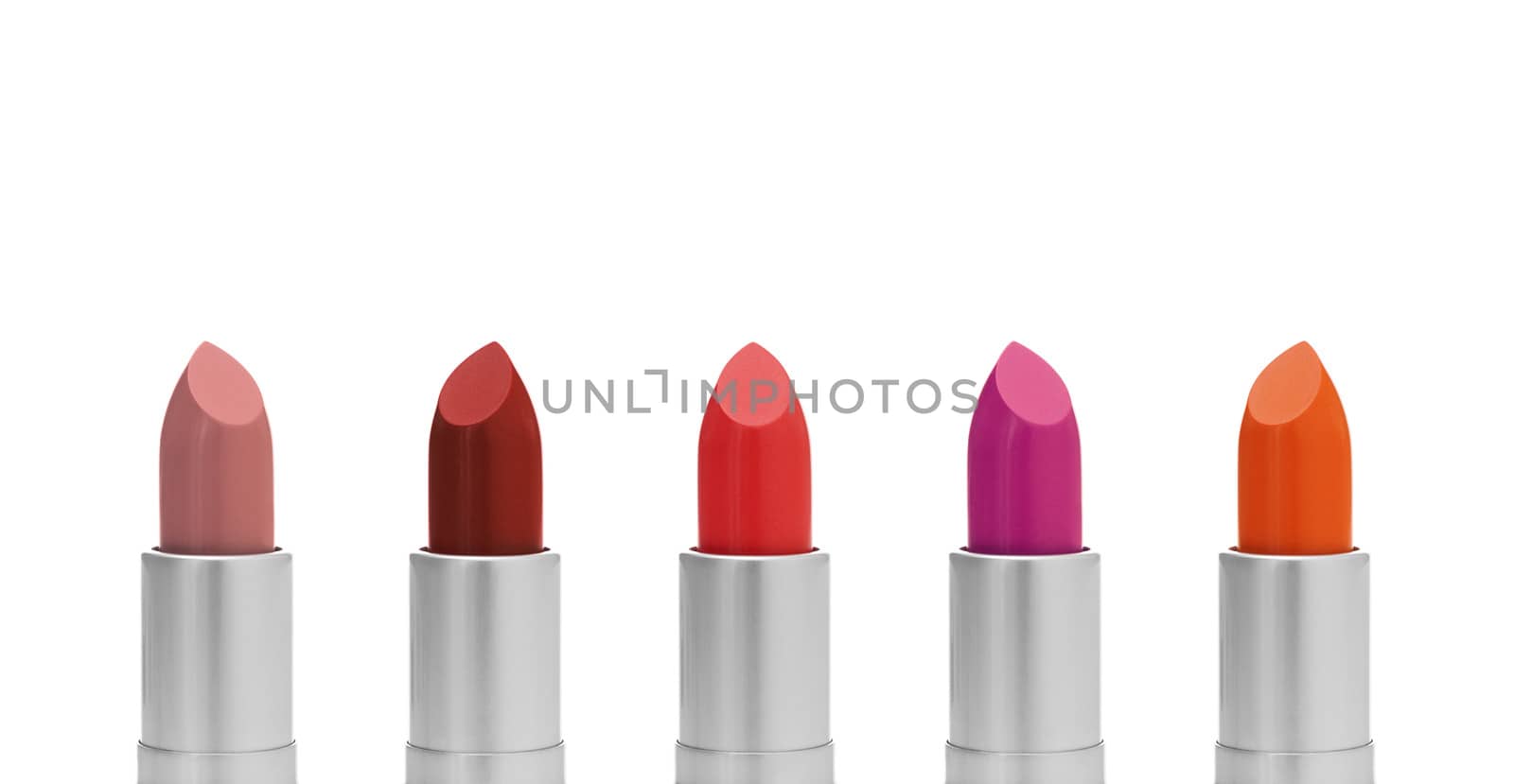 Lipstick of different colors, isolated on white background.