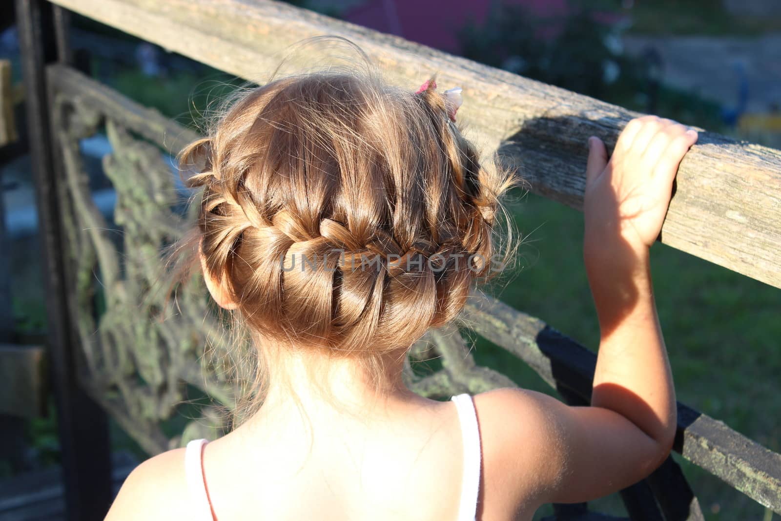little fashionable girl with beautiful modern coiffure