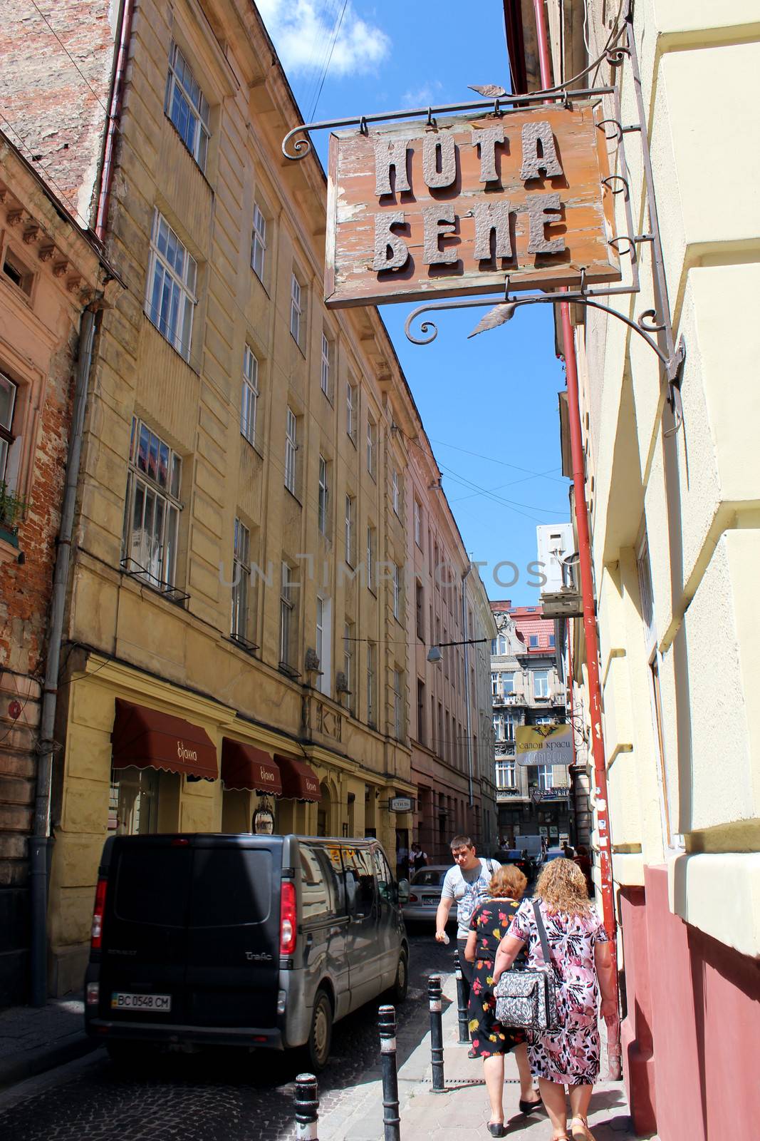 narrow street in Lvov with cozy caffe in the central part of Lvov