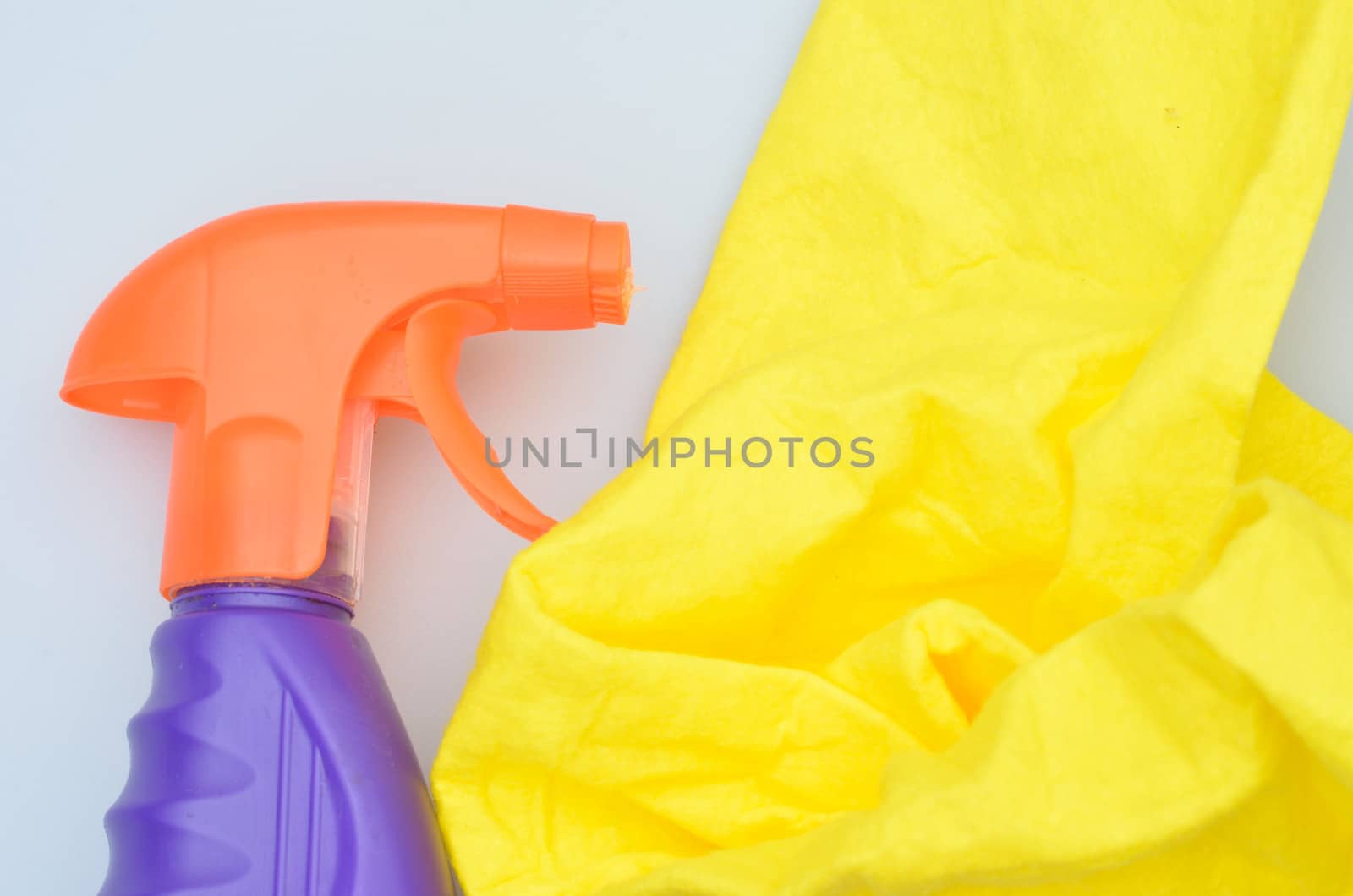 Close up of spray bottle and cloth