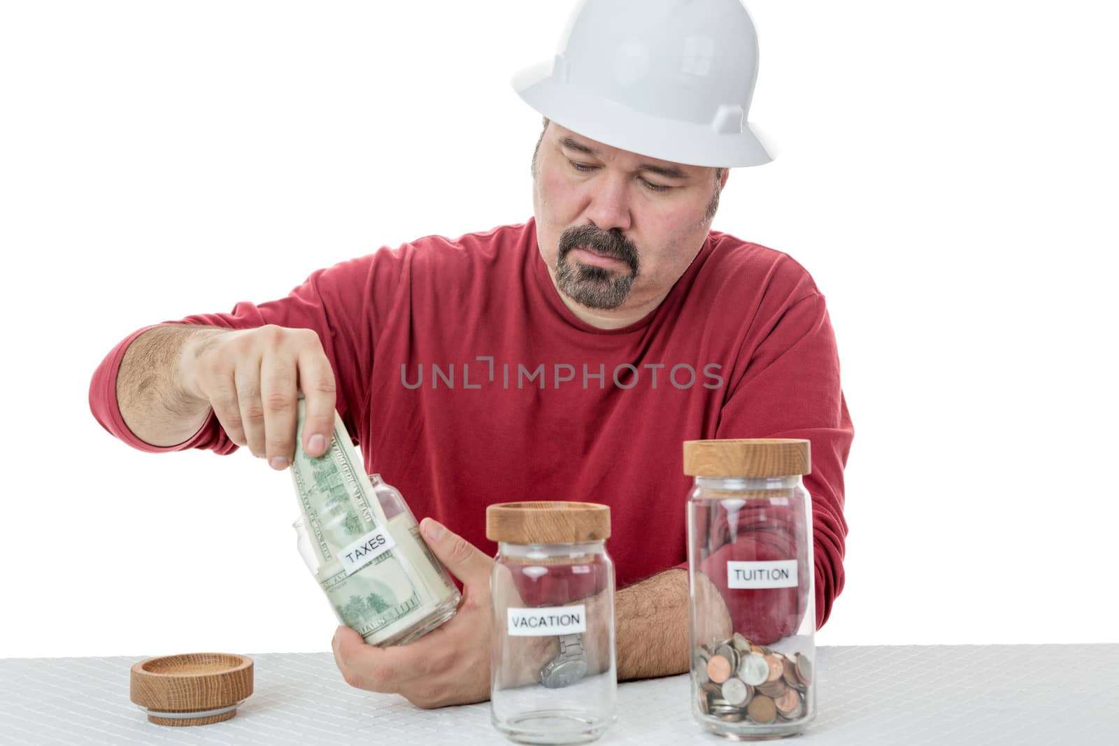 Unhappy construction worker destining all the money to taxes and left with coins for tuition and none for vacations