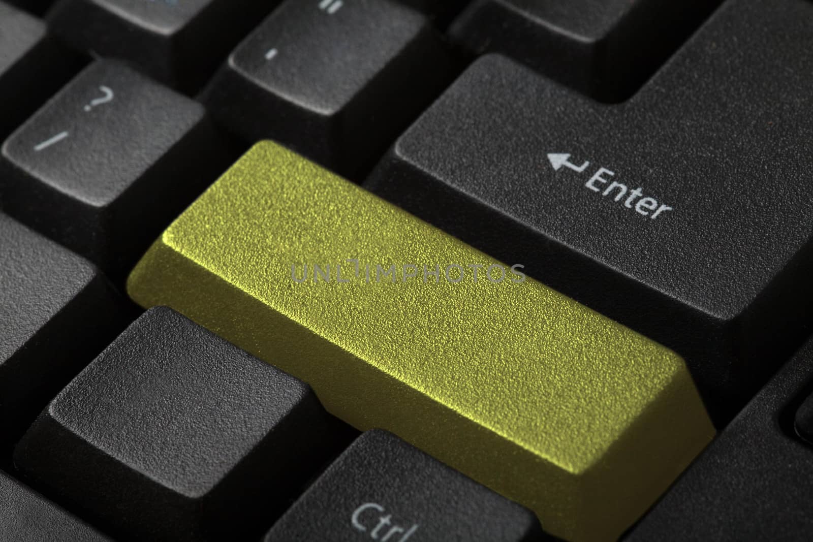 Blank gold button on the keyboard close-up