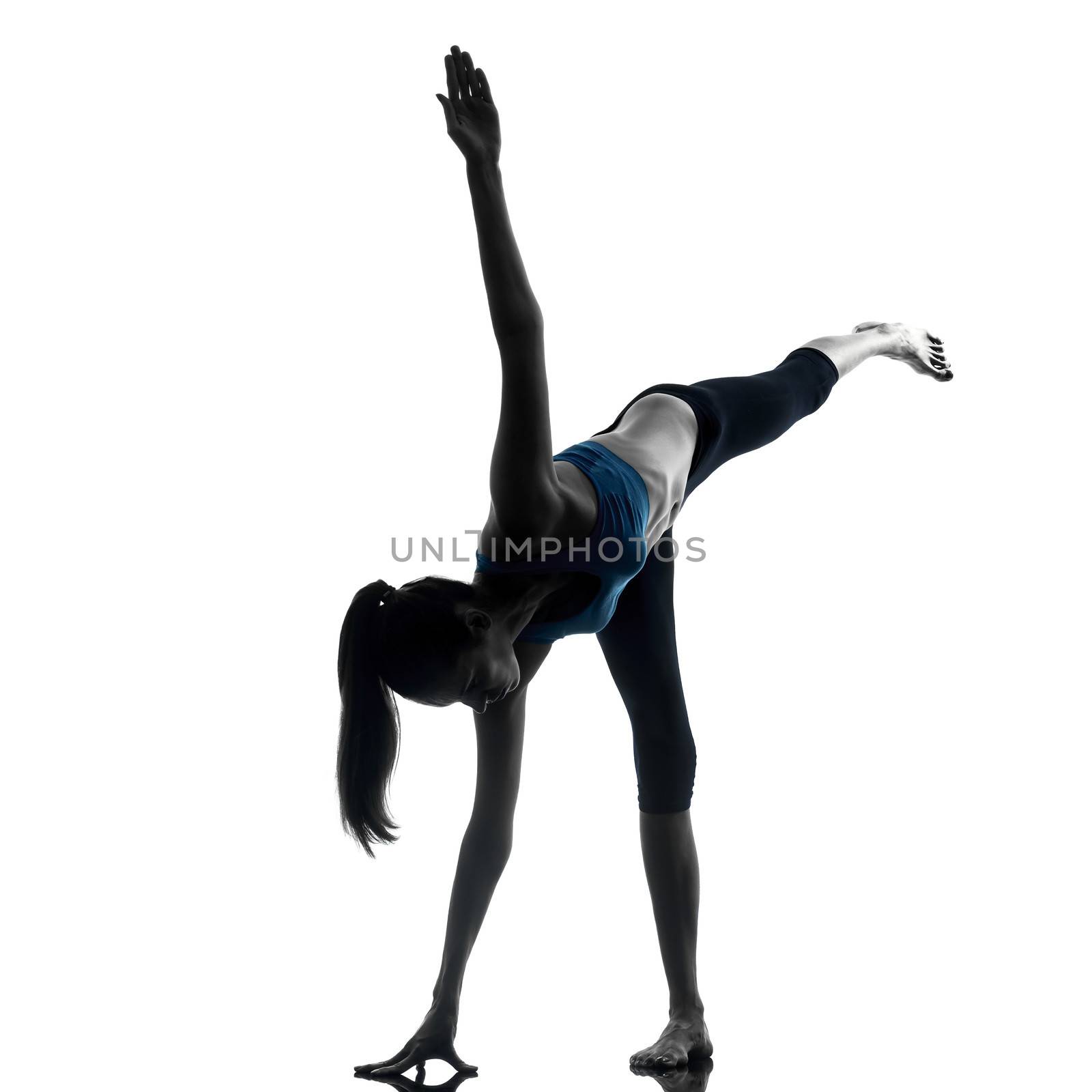 one caucasian woman exercising yoga standing on one leg in silhouette studio isolated on white background