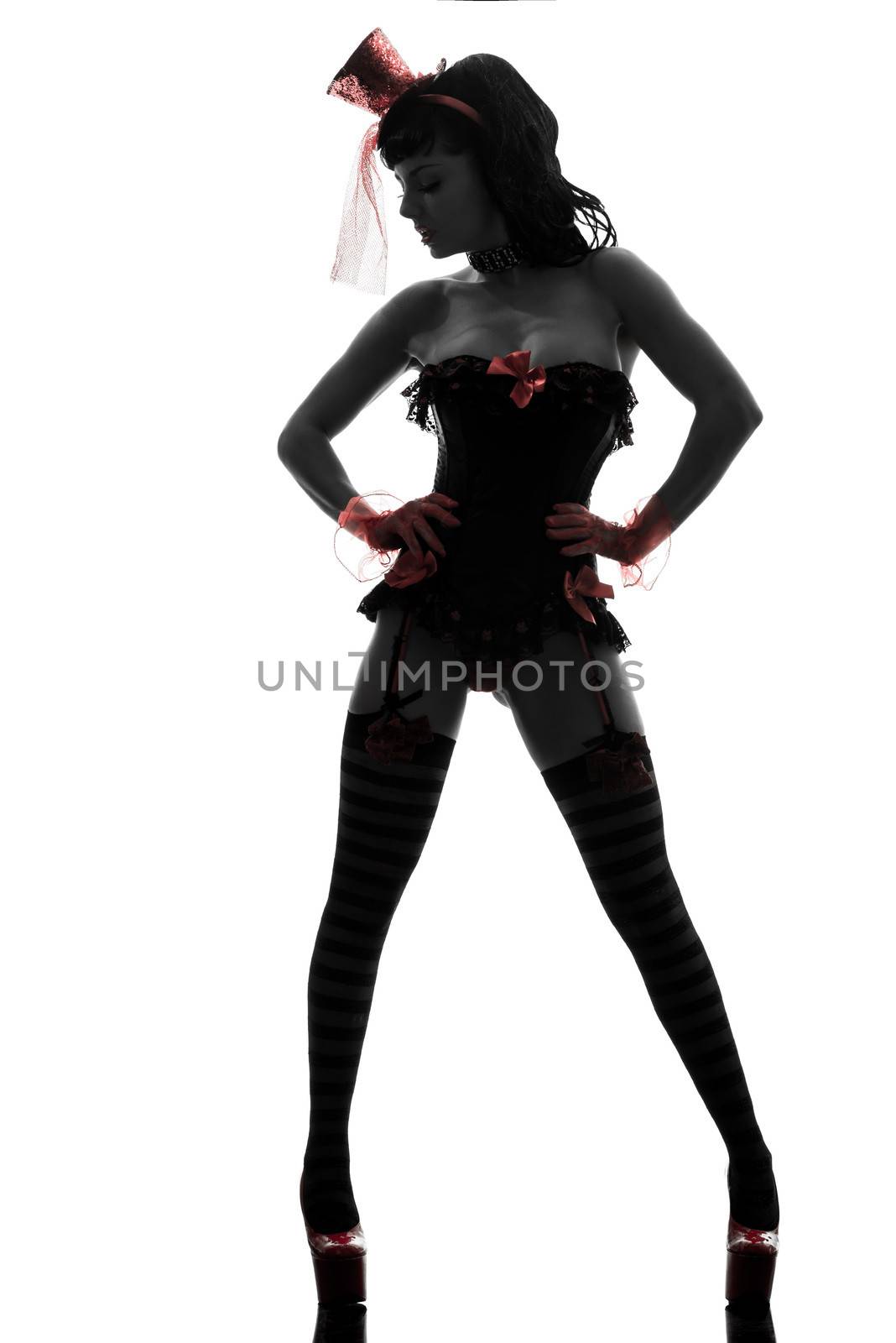 one sexy caucasian woman stripper showgirl  in silhouette studio isolated on white background