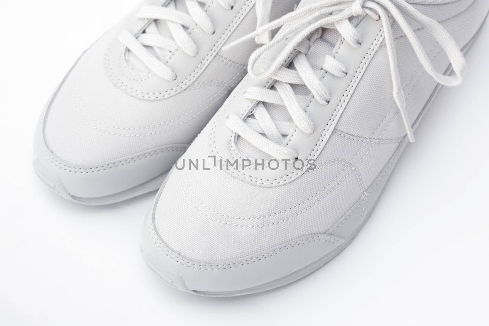 A pair of white running shoes