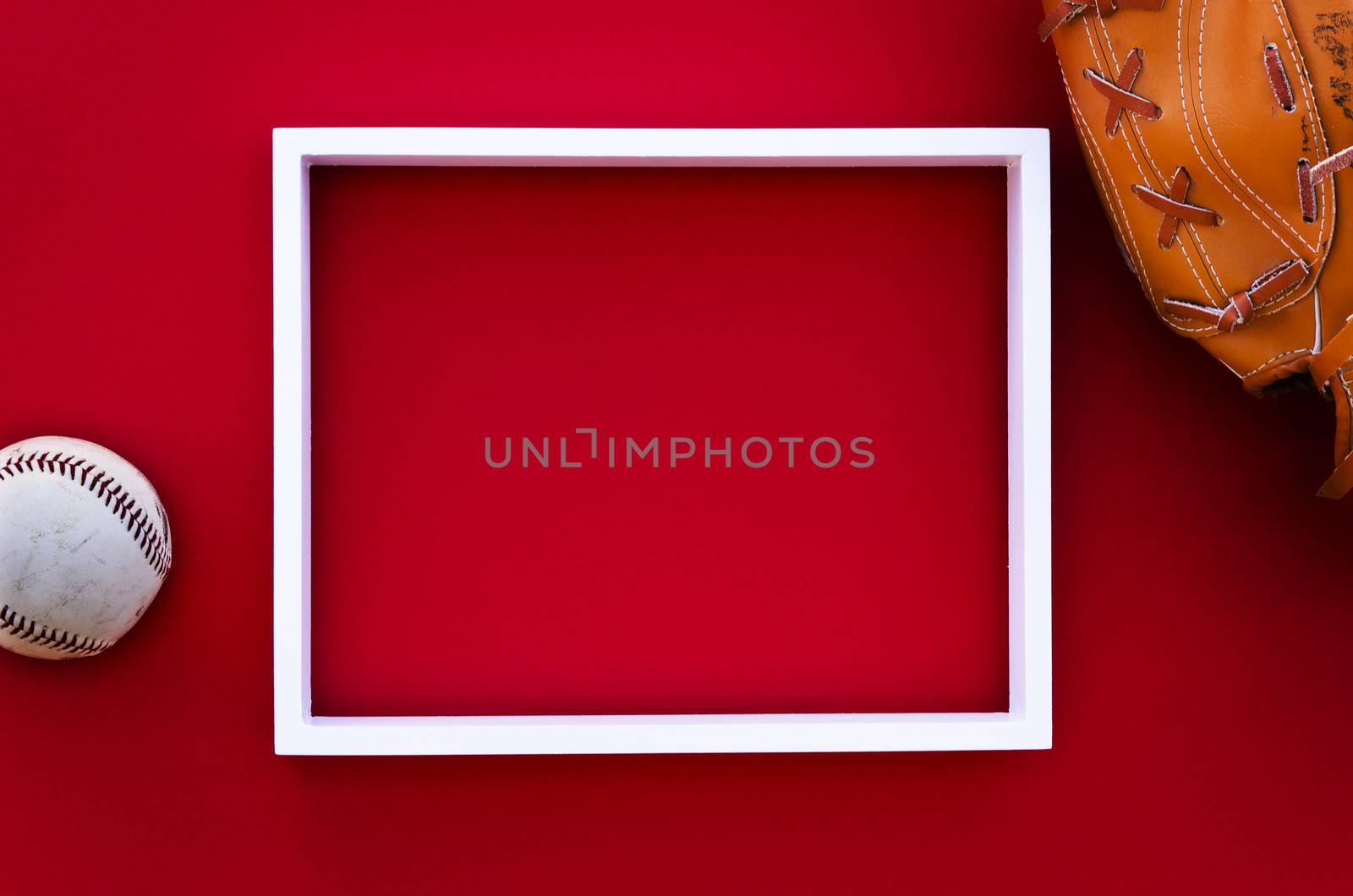 empty picture frame on a red wall with baseball equipment by Grufnar