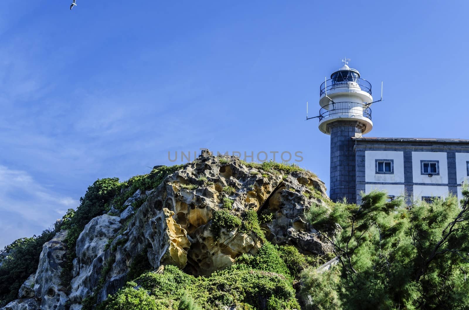 Looking at the lighthouse close to Getaria city in Spain. Beautiful environment and architecture.