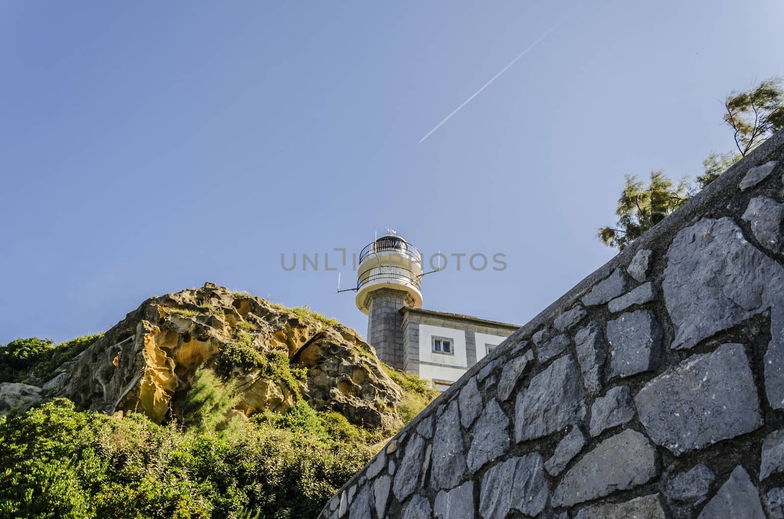 Looking at the lighthouse close to Getaria city in Spain. Beautiful environment and architecture.