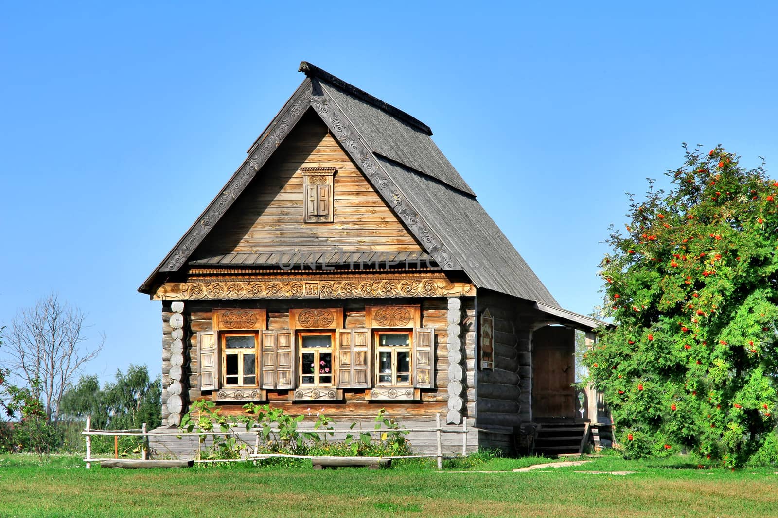 Old wooden house in a field