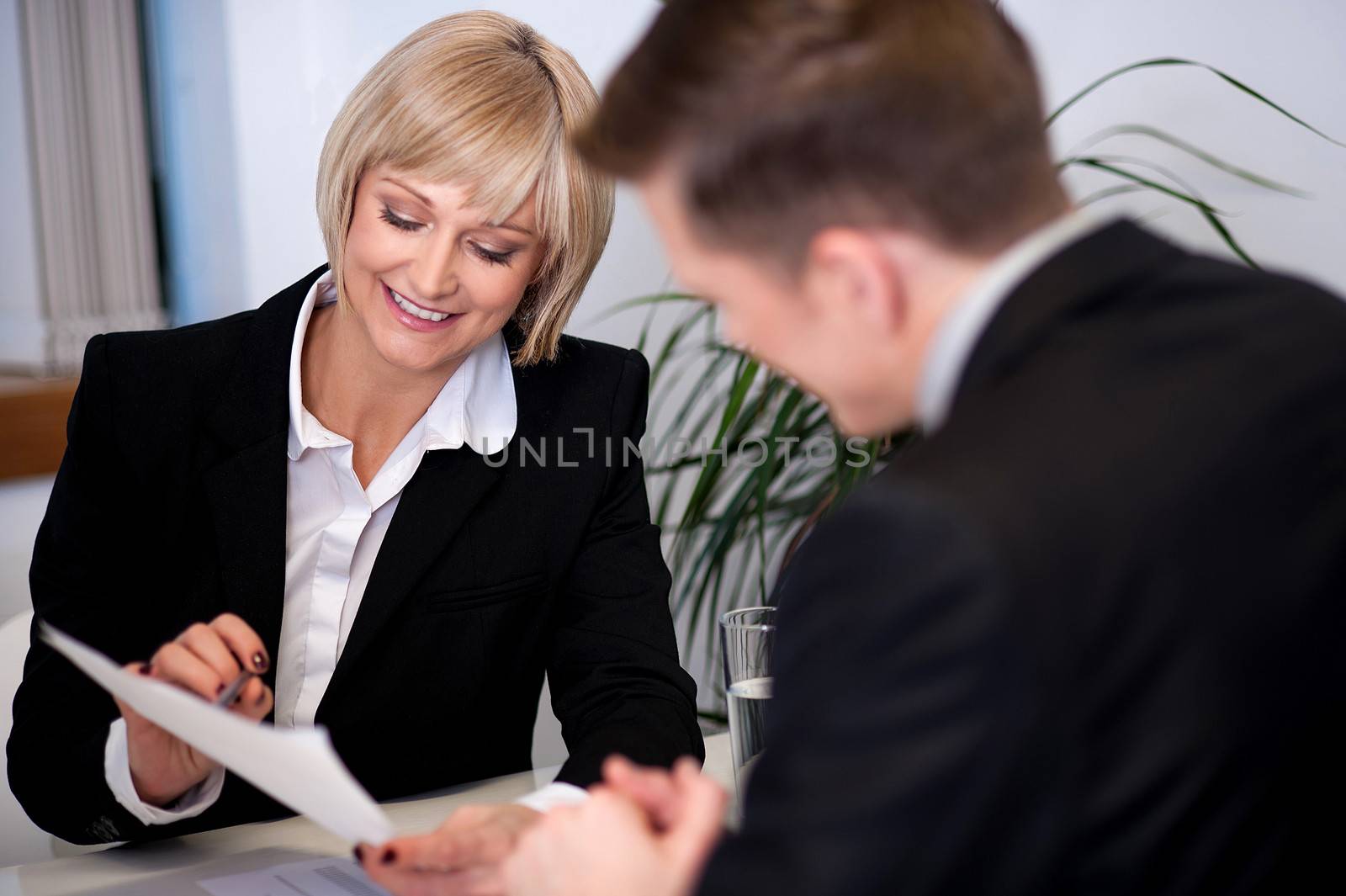 Manager working with his secretary by stockyimages