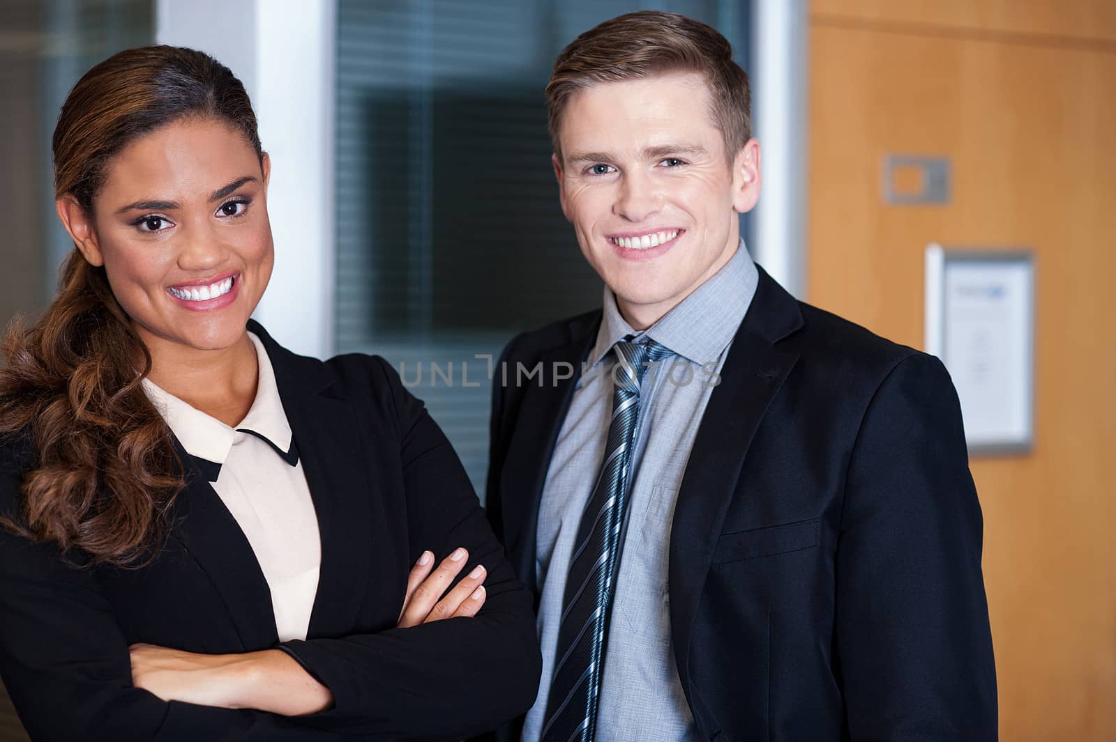 Business executives at office by stockyimages
