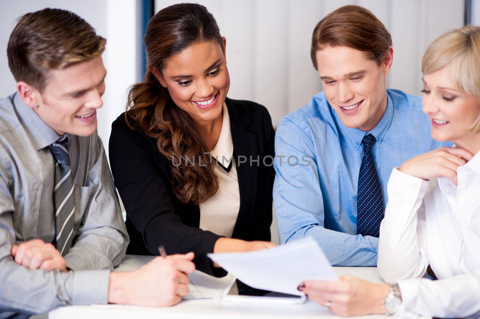 Business team discussing ideas by stockyimages