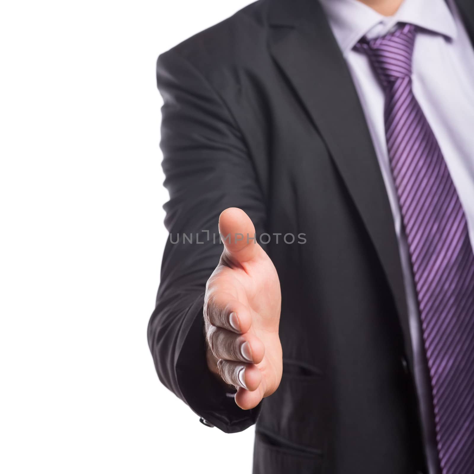 Mid section of an elegant businessman offering a handshake over white background