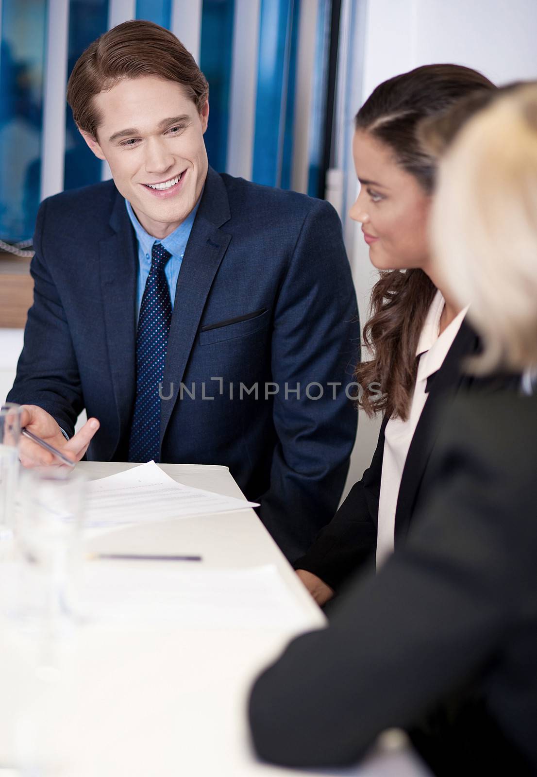 Partners at workplace discussing an idea by stockyimages