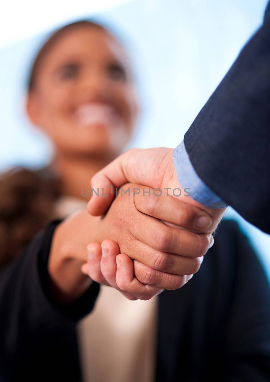 Image of two business people shaking hands